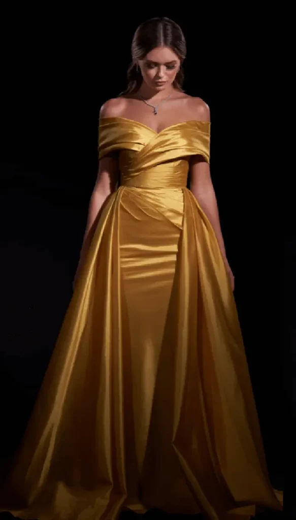 beautiful model wearing golden dress gown