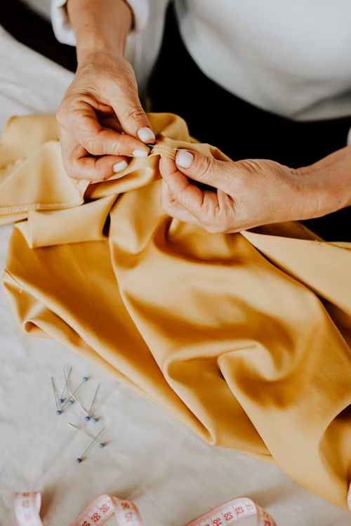 woman customizing a yellow couture dress Let’s break it all down in simple words.