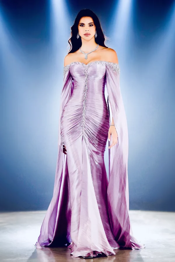 A woman wearing a purple-colored luxury gown