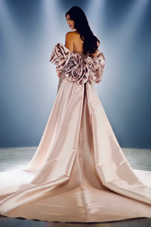 Woman showcasing the timeless evolution of gown dresses