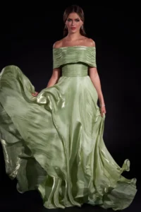 Elegant sage green off-shoulder ball gown with flowing silk fabric and dramatic train, perfect for formal events and galas