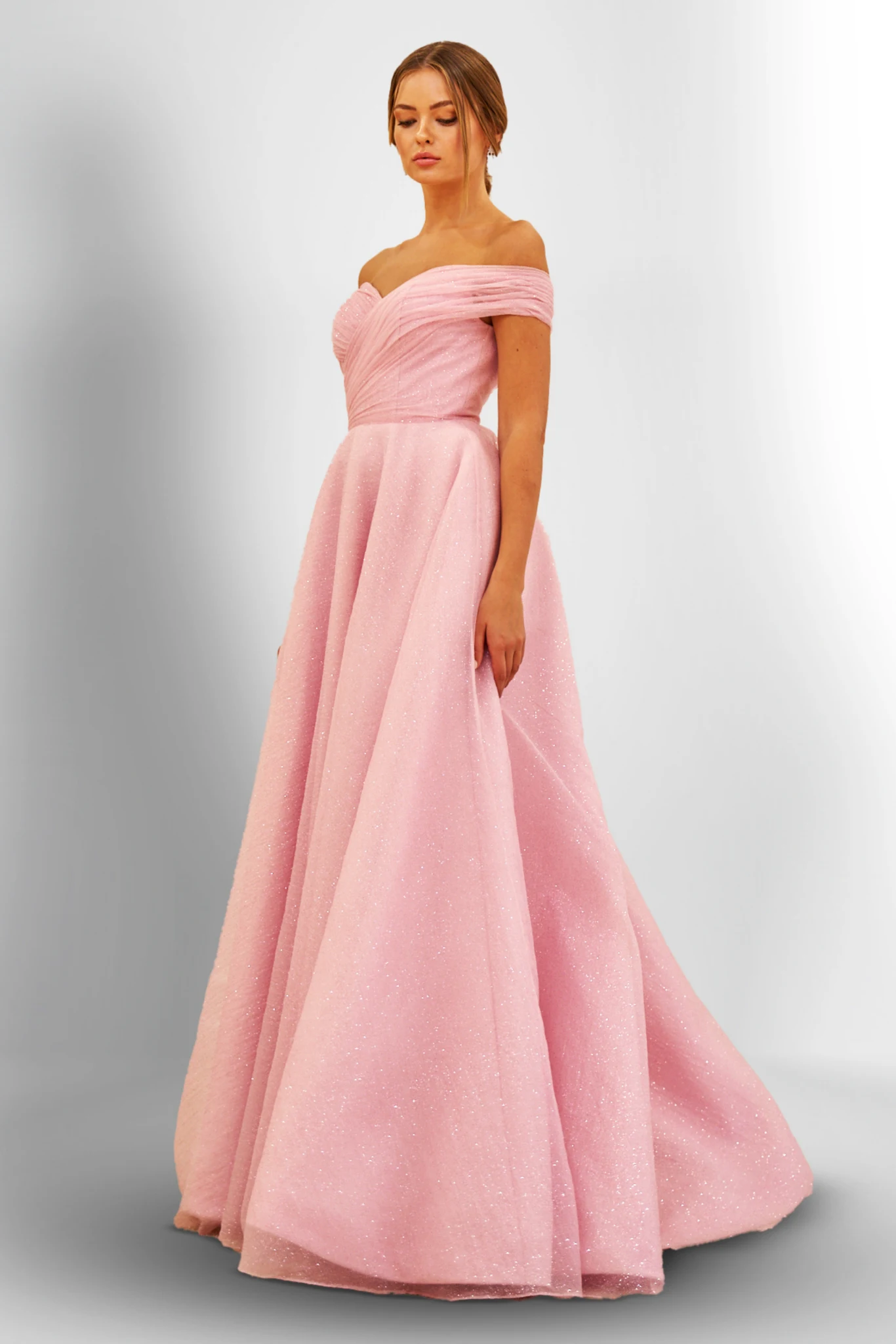 Elegant woman wearing a flowing long formal dress styled for evening occasions