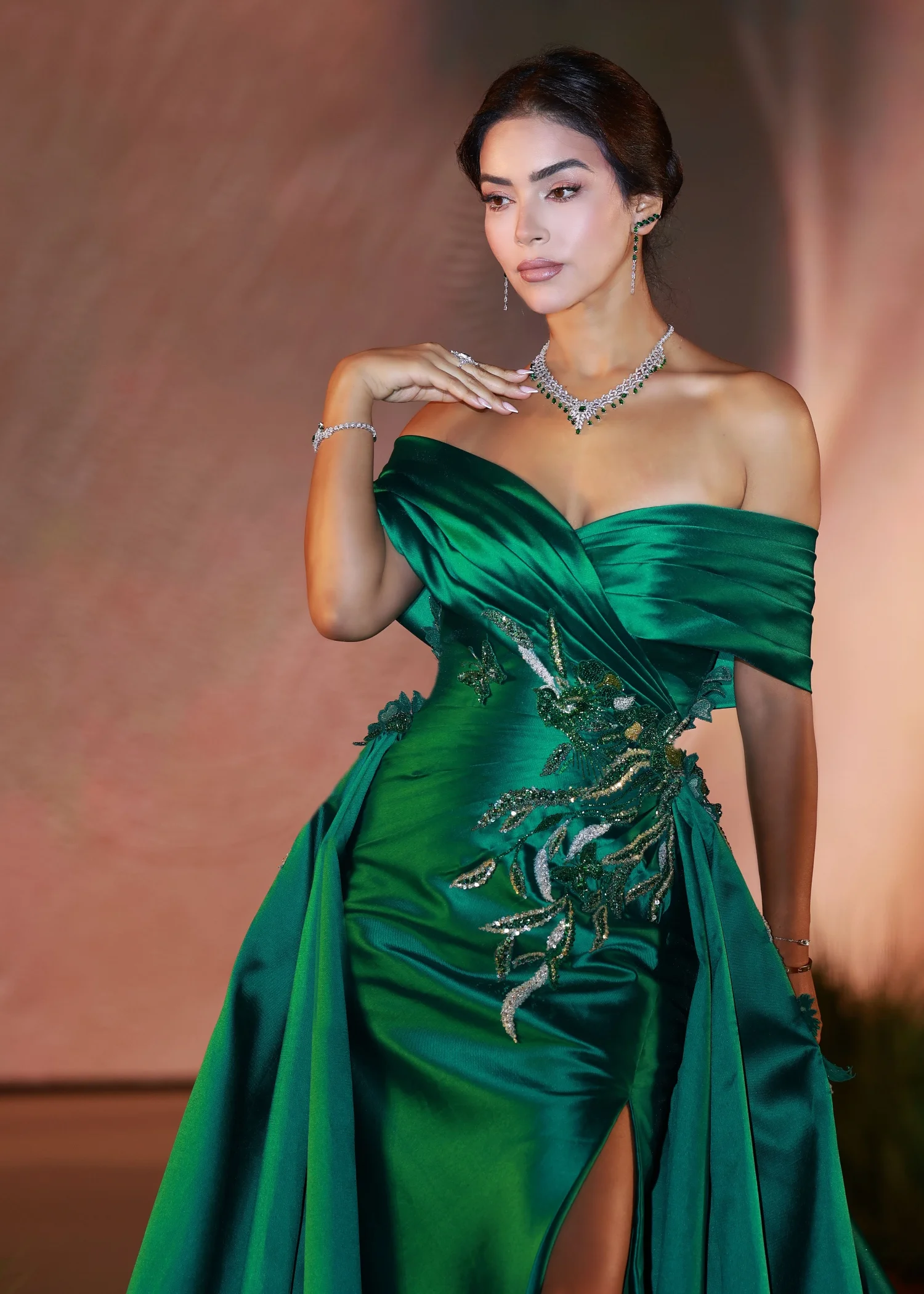 beautiful model in elegant green dress